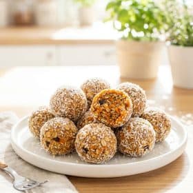 Close up of carrot cake energy balls with coconut coating