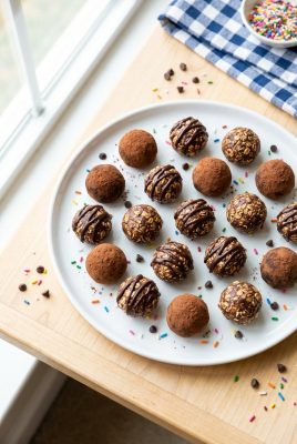 Chocolate peanut butter energy bites on a white plate
