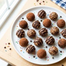 Chocolate peanut butter energy bites on a white plate