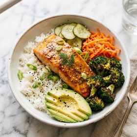Honey mustard salmon bowl with jasmine rice broccoli and avocado