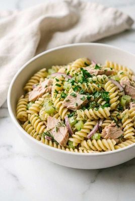 Tuna pasta salad in a white bowl